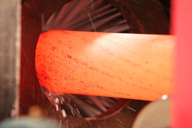 Red-hot steel bar inside an induction coil