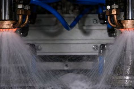 Quench spray under two hardening inductors